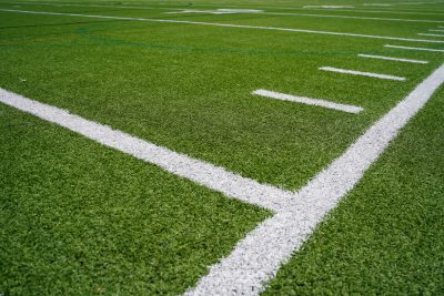 Image of an American football field with yard lines