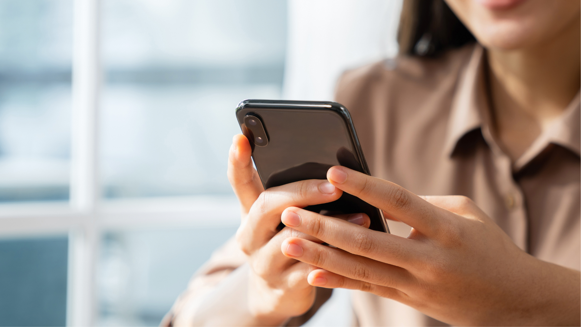 Image of hands holding a smartphone
